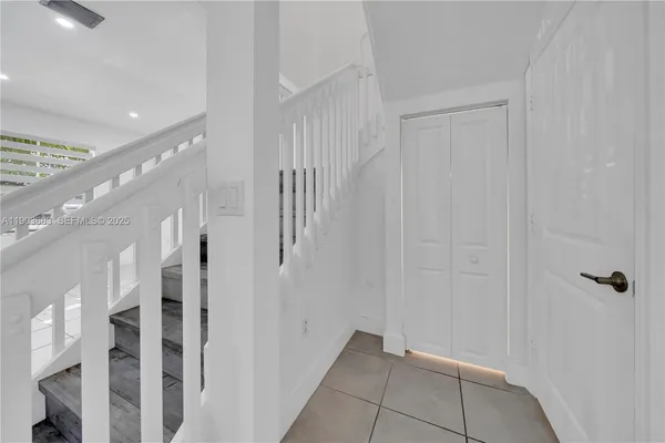 a view of a hallway with staircase