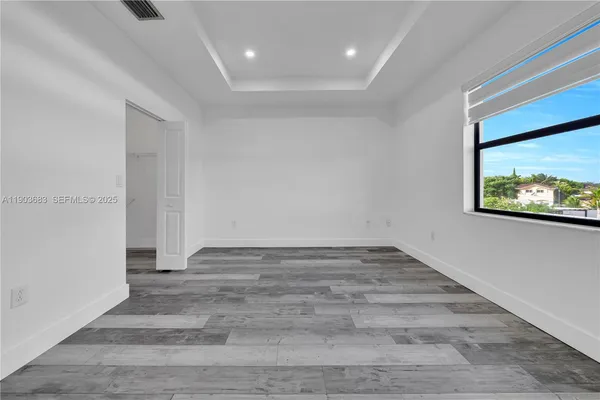 a view of an empty room and window