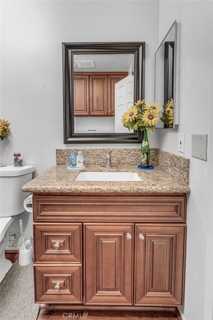 9212 Beverly Road Pico Rivera, CA 90660 - Photo 11 of 43 a bathroom with a sink and a mirror