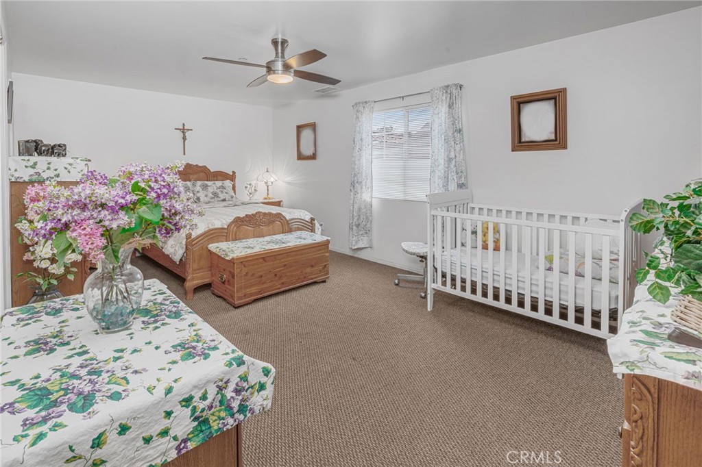 9212 Beverly Road Pico Rivera, CA 90660 - Photo 12 of 43 a bedroom with bed and a window