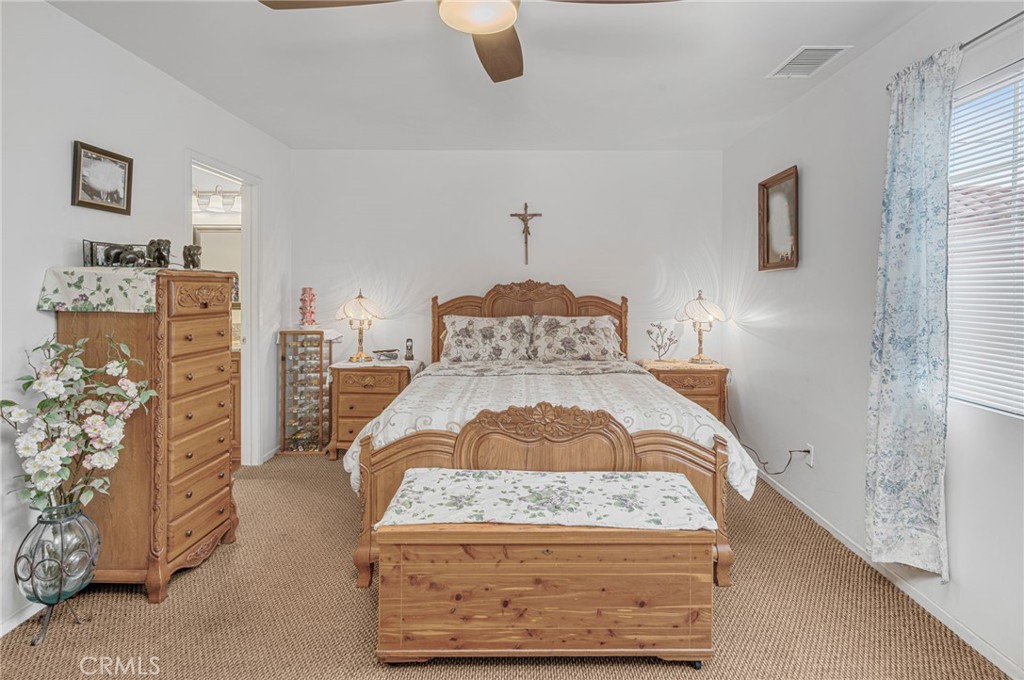 9212 Beverly Road Pico Rivera, CA 90660 - Photo 13 of 43 a bedroom with a bed and a dresser