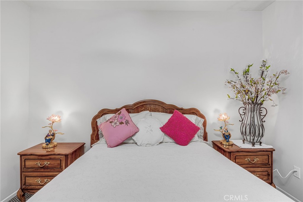 9212 Beverly Road Pico Rivera, CA 90660 - Photo 20 of 43 a bedroom with a bed and a potted plant