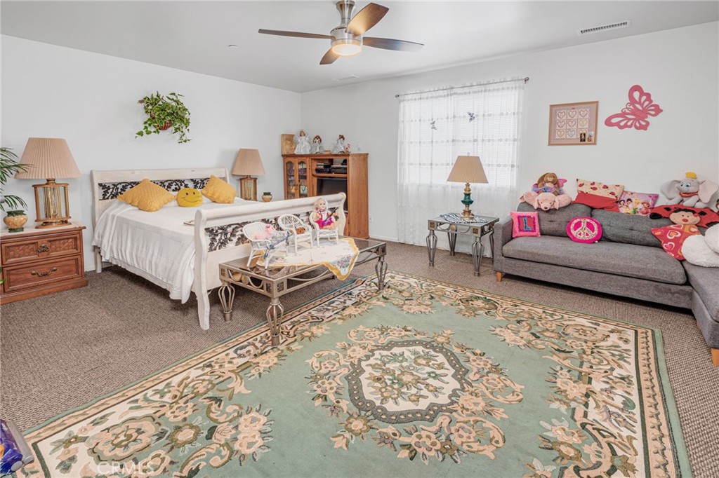 9212 Beverly Road Pico Rivera, CA 90660 - Photo 22 of 43 a bedroom with furniture and a bed