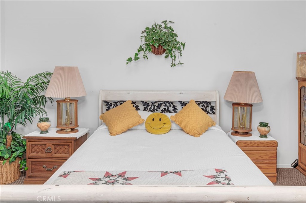 9212 Beverly Road Pico Rivera, CA 90660 - Photo 23 of 43 a bed room with a bed and a lamp