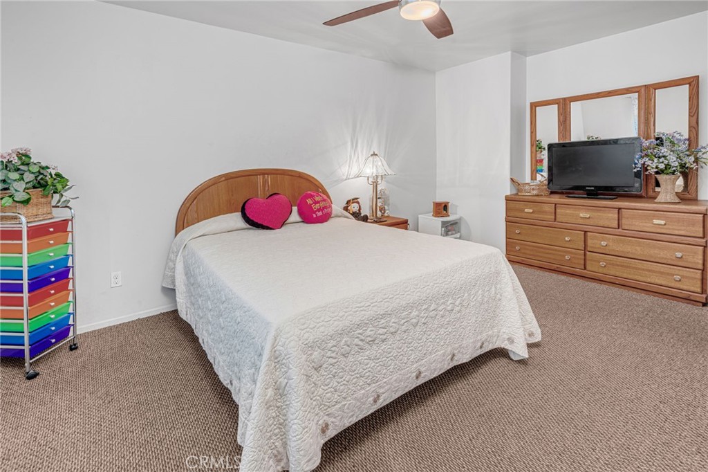 9212 Beverly Road Pico Rivera, CA 90660 - Photo 25 of 43 a bedroom with a bed and a dresser in it