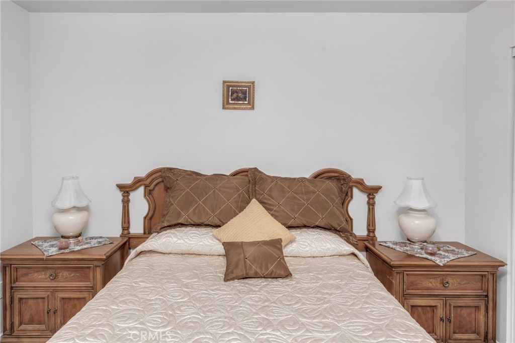 9212 Beverly Road Pico Rivera, CA 90660 - Photo 27 of 43 a spacious bedroom with a bed and window