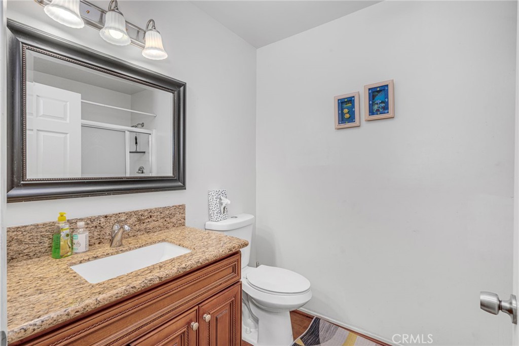 9212 Beverly Road Pico Rivera, CA 90660 - Photo 29 of 43 a bathroom with a granite countertop sink and a mirror
