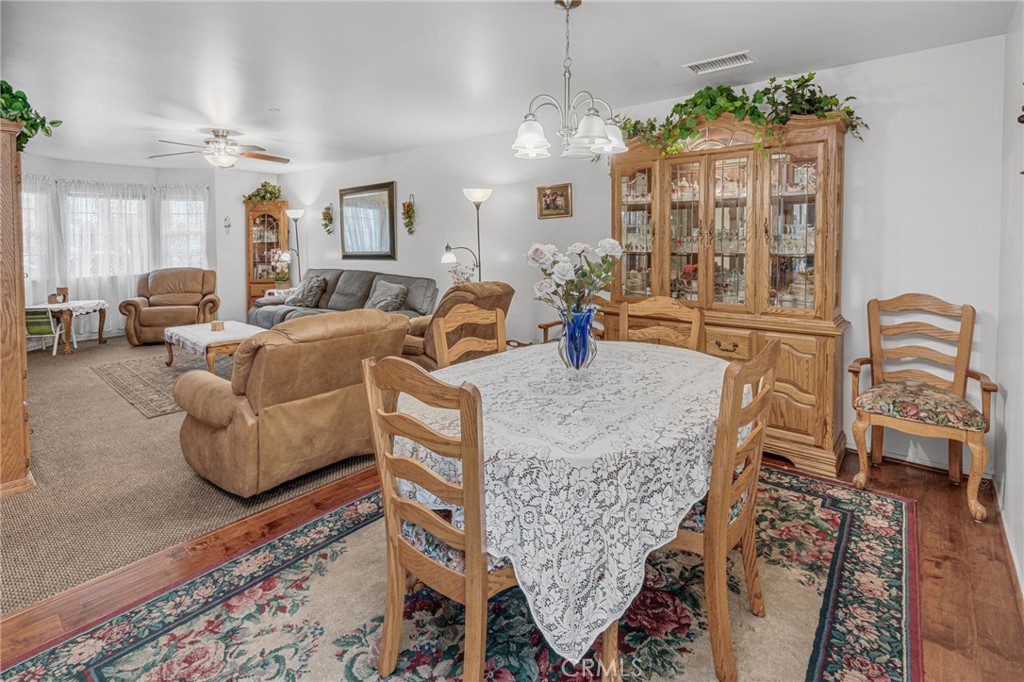 9212 Beverly Road Pico Rivera, CA 90660 - Photo 41 of 43 a living room with furniture and a chandelier