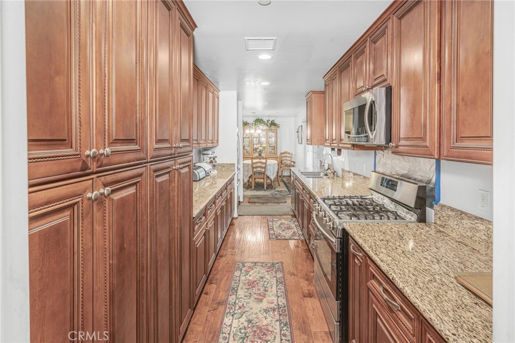 9212 Beverly Road Pico Rivera, CA 90660 - Photo 10 of 43 a view of a kitchen with granite countertop a sink and dishwasher