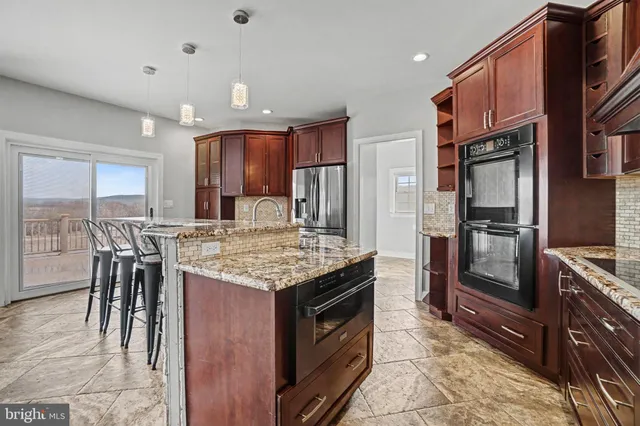 a living room with furniture wooden floor and a flat screen tv