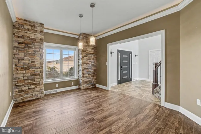 a bathroom with a granite countertop bathtub sink vanity mirror and toilet