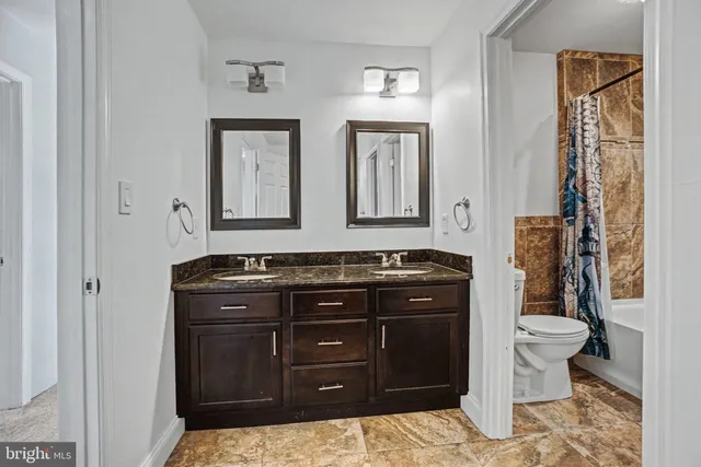 a picture of a bench in front of a wall