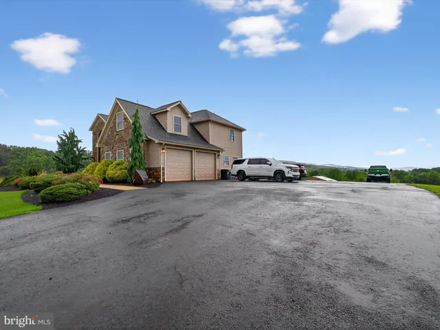 an aerial view of a house with outdoor space