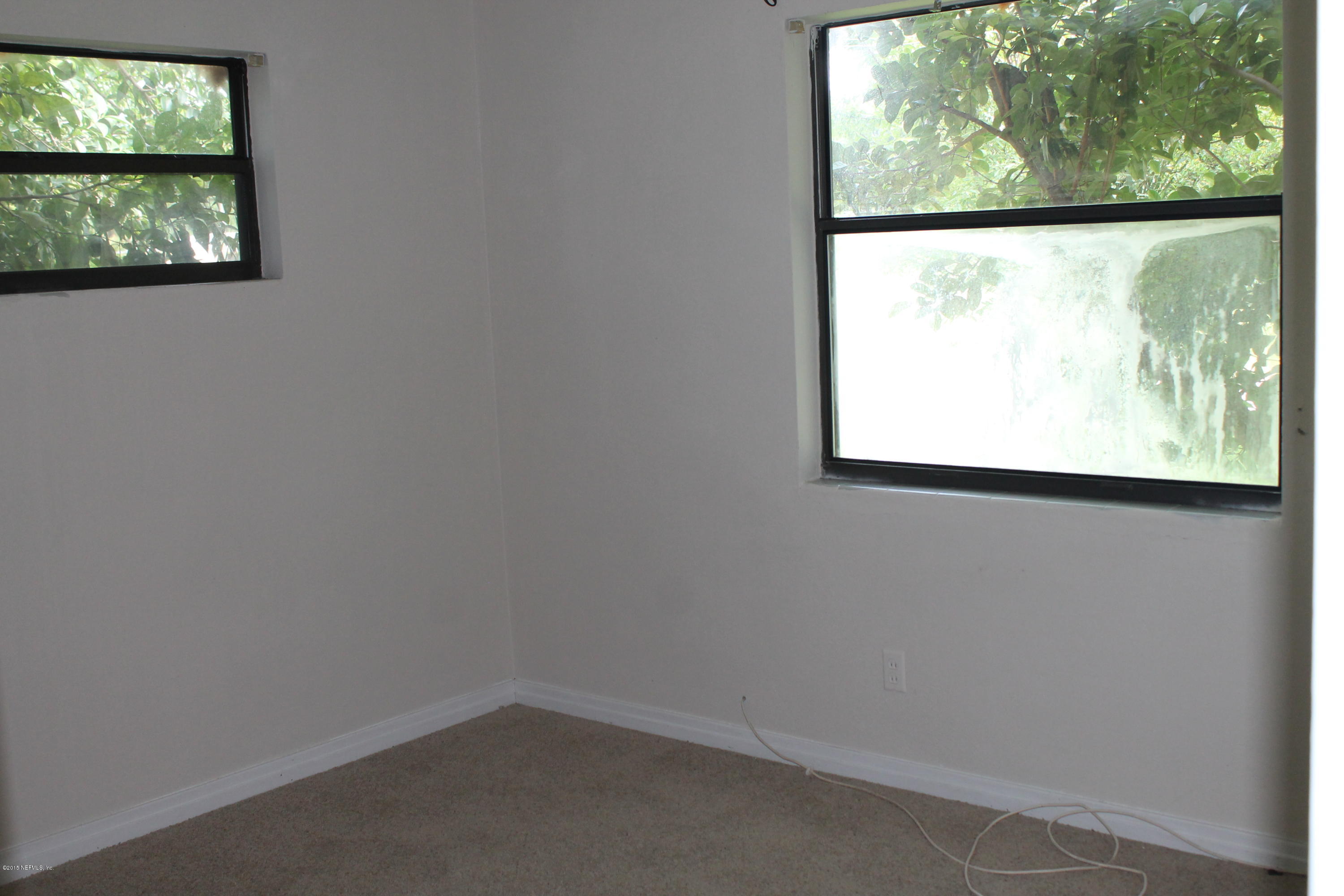 2712 Lorna Road Jacksonville, FL 32211 - Photo 13 of 30 an empty room with a window