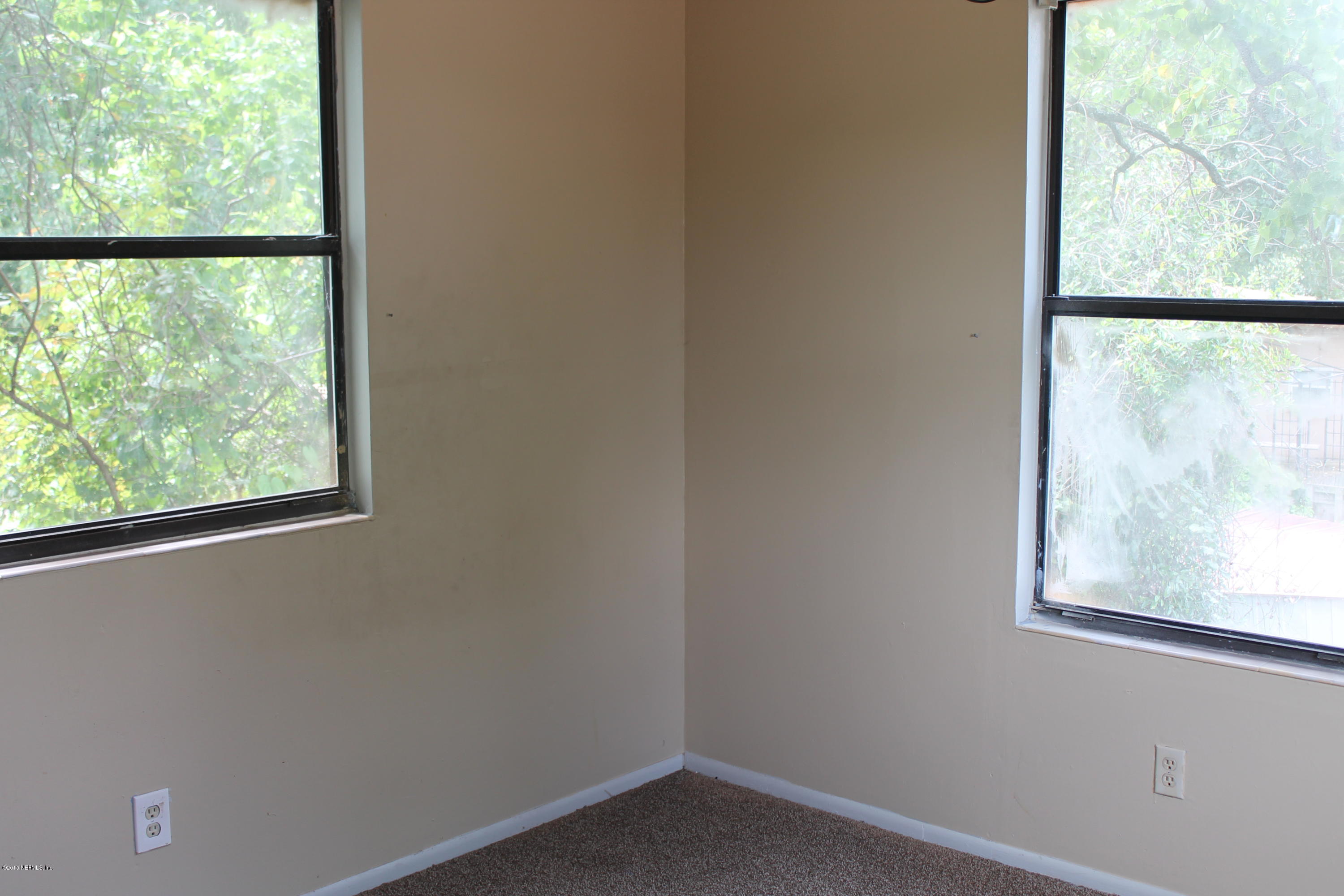 2712 Lorna Road Jacksonville, FL 32211 - Photo 21 of 30 an empty room with a window