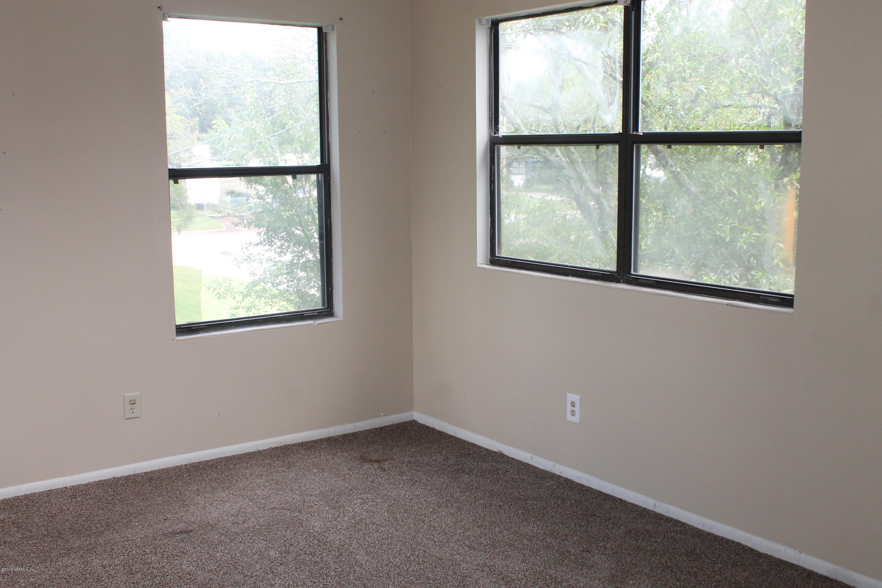 2712 Lorna Road Jacksonville, FL 32211 - Photo 23 of 30 an empty room with a window