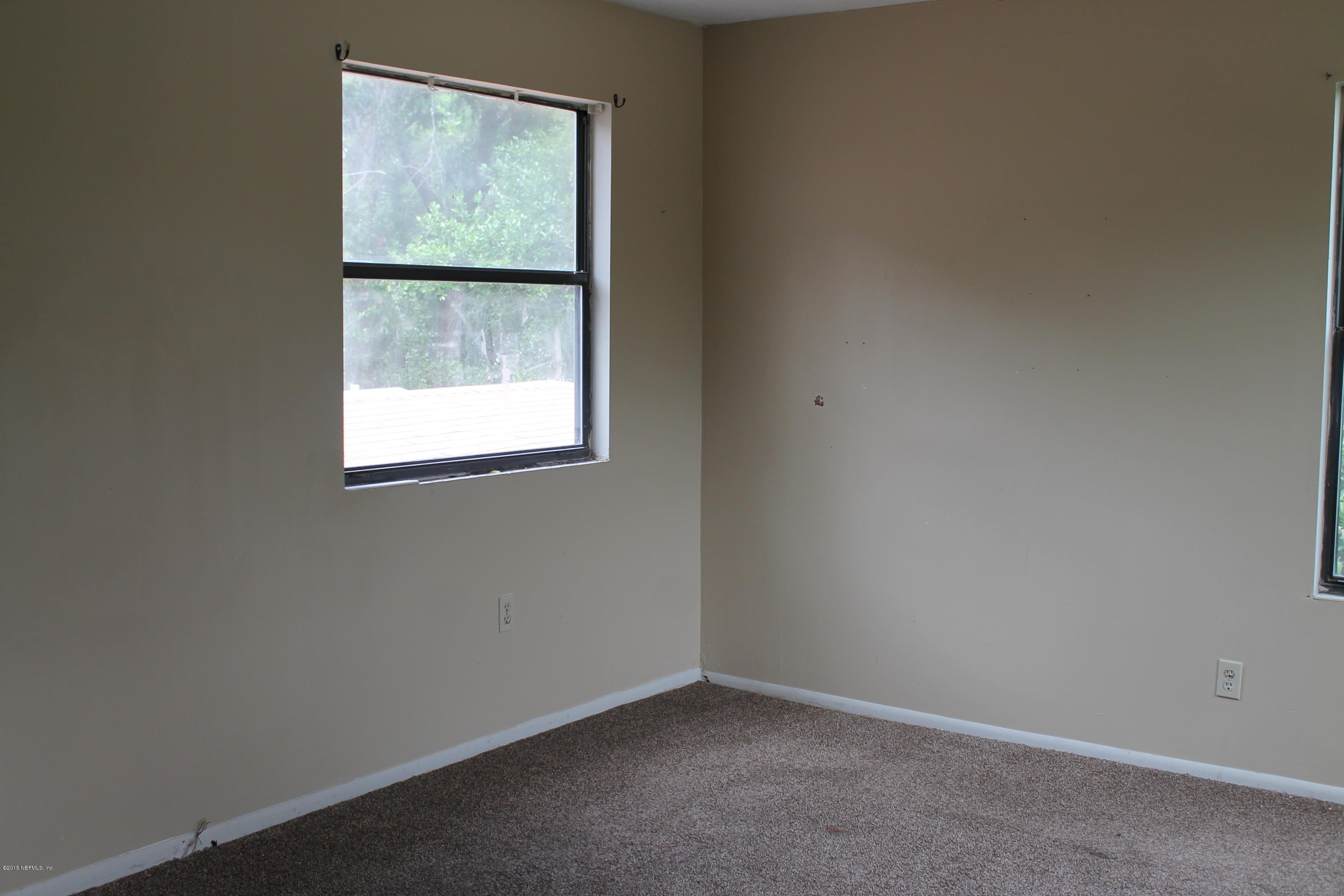 2712 Lorna Road Jacksonville, FL 32211 - Photo 24 of 30 an empty room with a window
