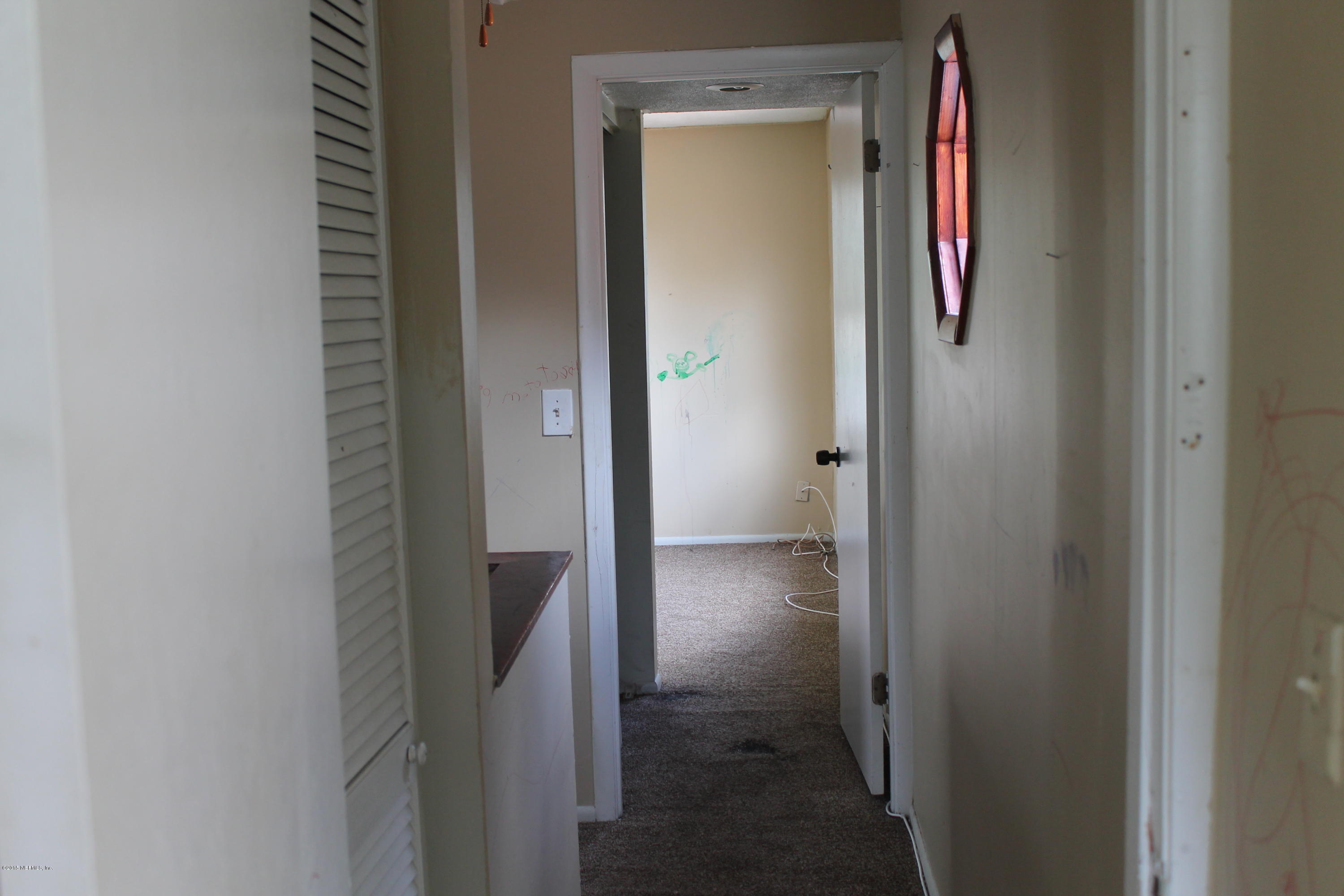 2712 Lorna Road Jacksonville, FL 32211 - Photo 27 of 30 a view of a hallway with wooden floor and closet