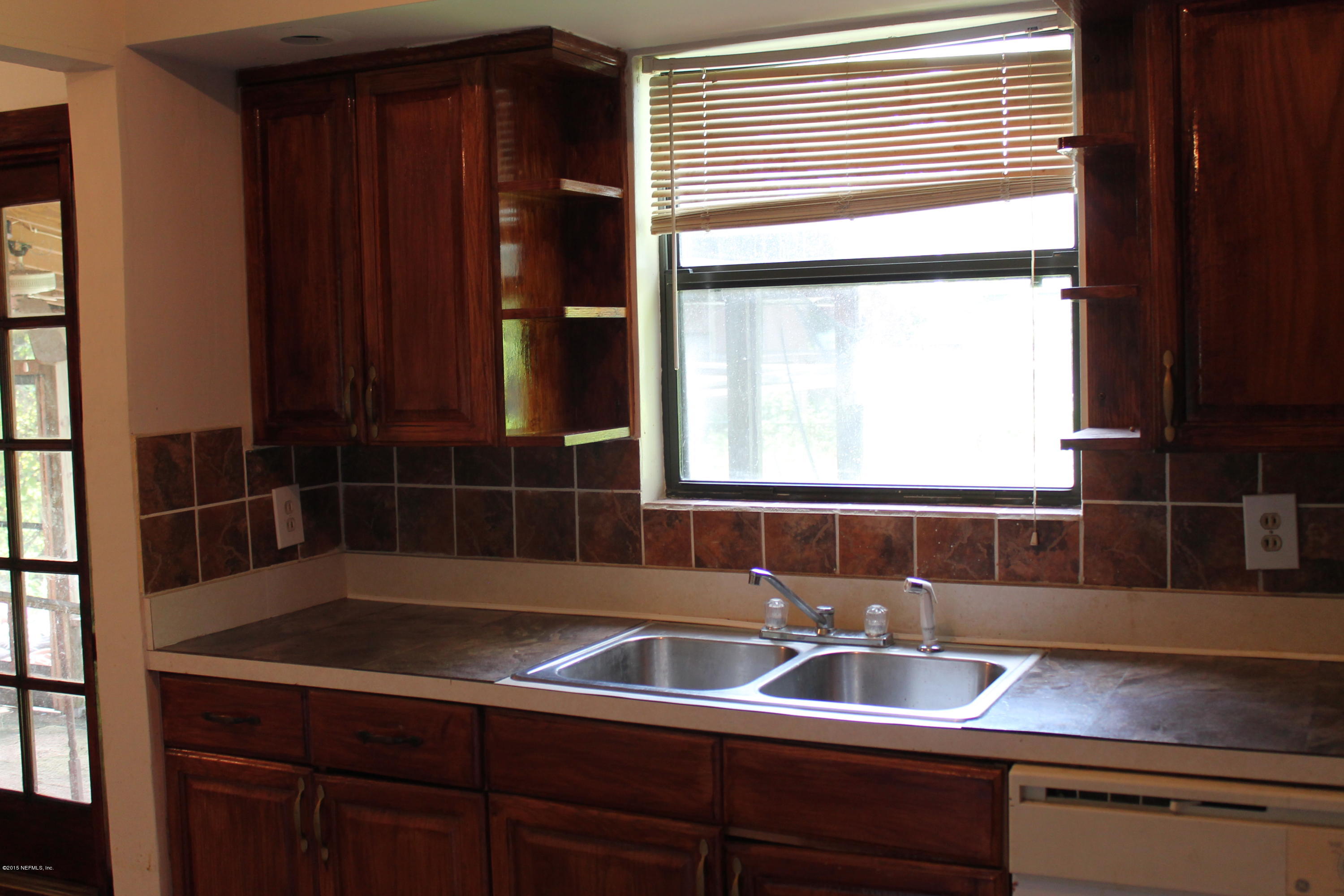 2712 Lorna Road Jacksonville, FL 32211 - Photo 7 of 30 a bathroom with a sink and a mirror