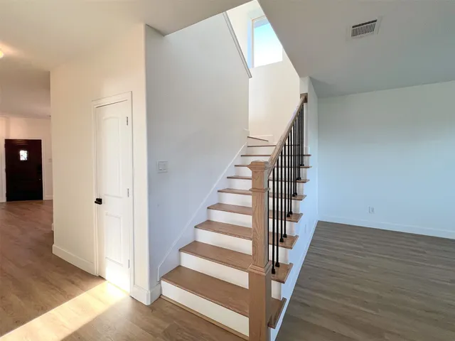 a view of entryway with wooden floor