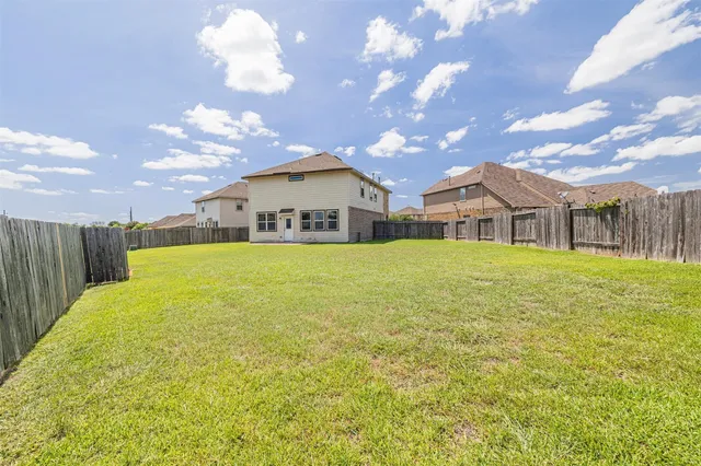 a view of a house with a big yard