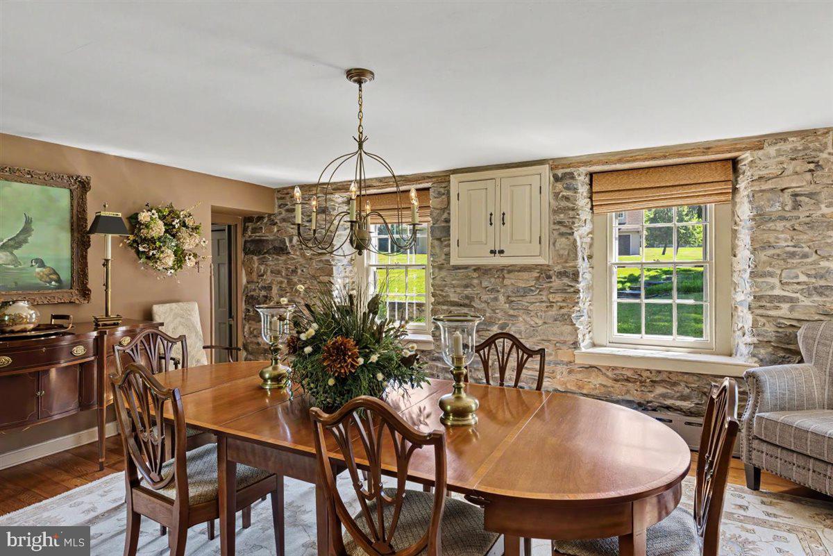 144 Creek Road Chalfont, PA 18914 - Photo 26 of 48 Formal dining room with stone wall