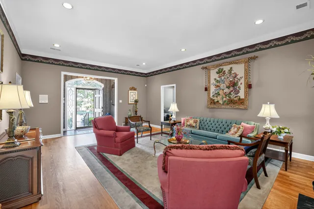 a living room with furniture and a lamp
