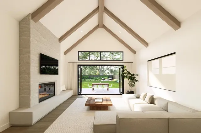 a living room with fireplace furniture and a flat screen tv