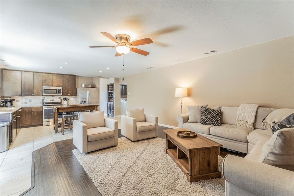 5109 Reed Drive The Colony, TX 75056 - Photo 5 of 14 a living room with furniture and view of kitchen