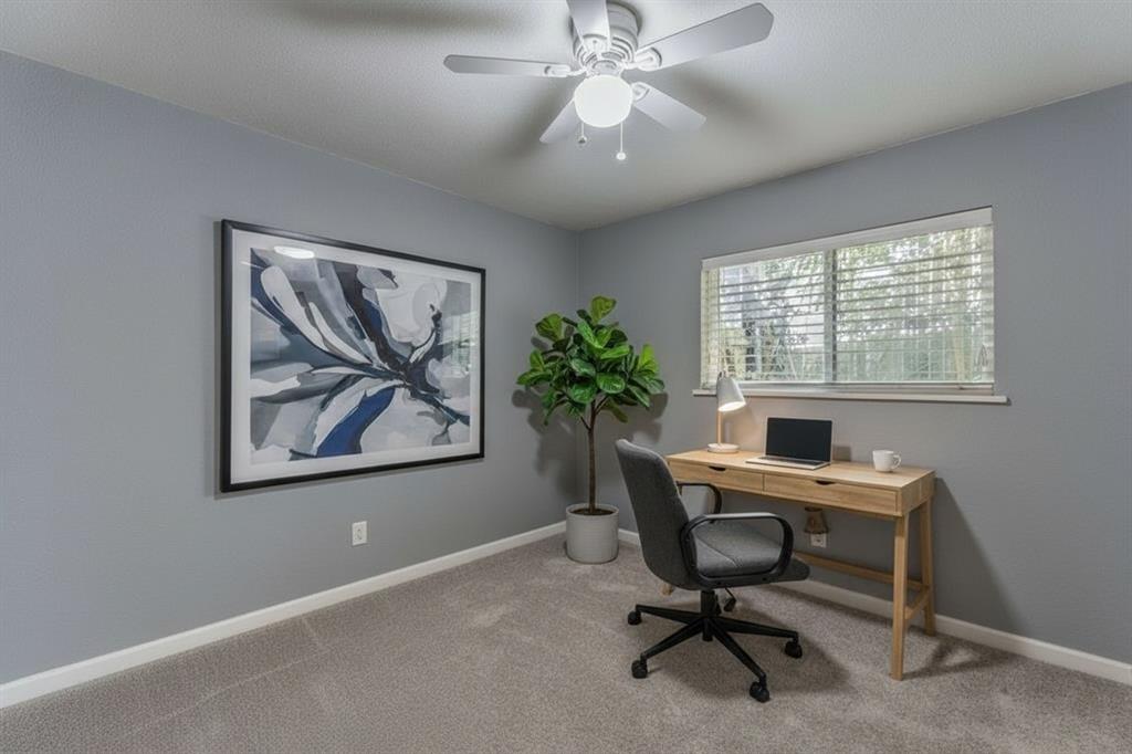 5109 Reed Drive The Colony, TX 75056 - Photo 10 of 14 a view of a workspace with a window and a workspace
