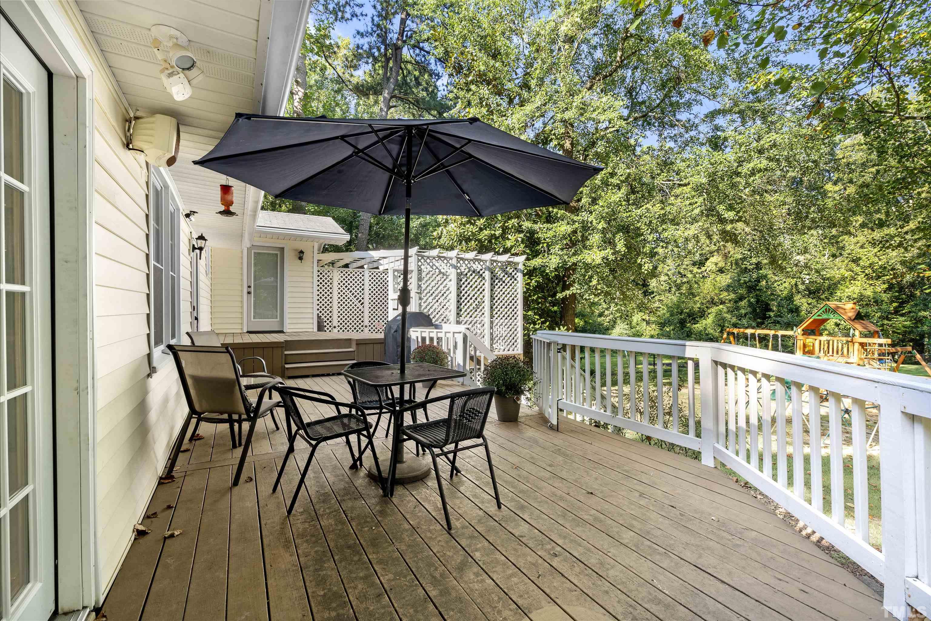 4209 Rowan Street Raleigh, NC 27609 - Photo 38 of 44 a view of balcony with furniture and wooden floor