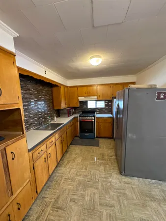 a view of gallery with wooden floor