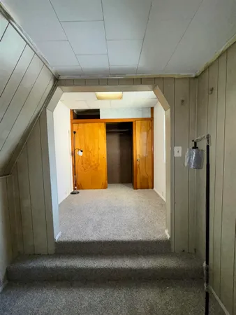 a view of walk in closet with wooden floor