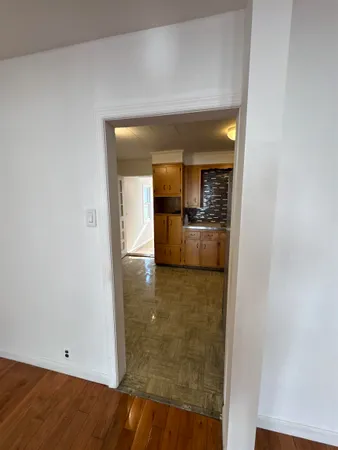 a large kitchen with stainless steel appliances kitchen island granite countertop a large counter top and wooden cabinets