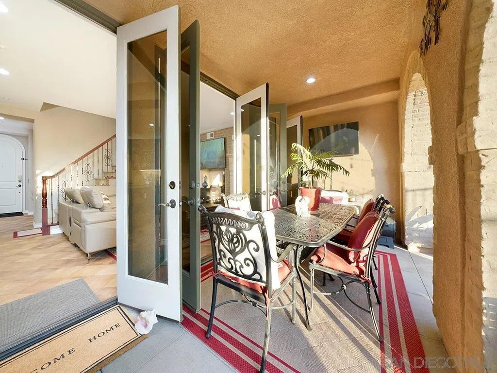 33 Tuscany Ladera Ranch, CA 92694 - Photo 12 of 50 a dining room with furniture and a floor to ceiling window