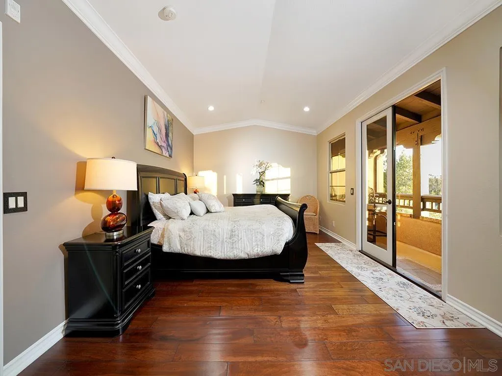 33 Tuscany Ladera Ranch, CA 92694 - Photo 14 of 50 a bedroom with a bed and wooden floor