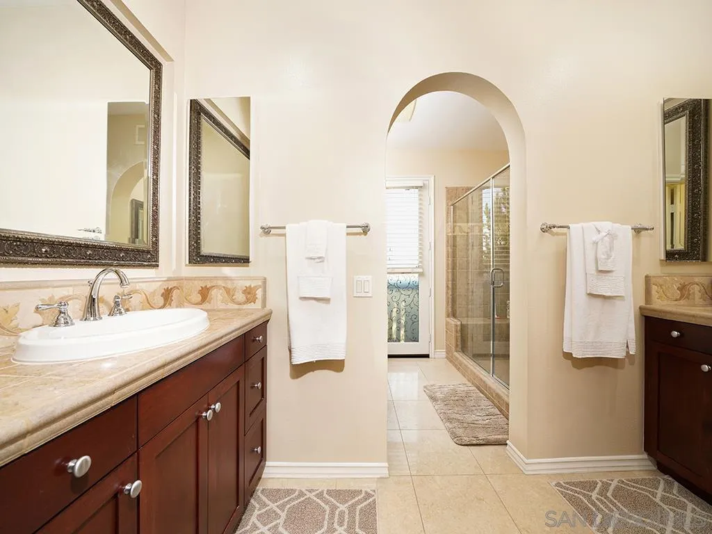 33 Tuscany Ladera Ranch, CA 92694 - Photo 16 of 50 a spacious bathroom with a double vanity sink a mirror and a shower