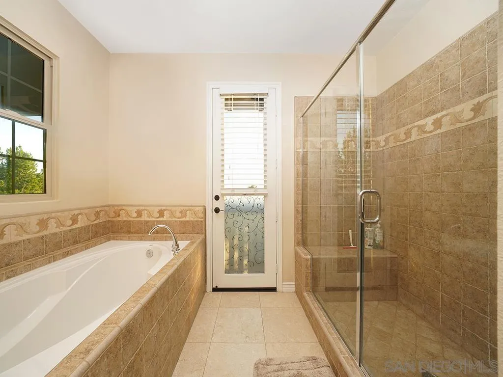 33 Tuscany Ladera Ranch, CA 92694 - Photo 18 of 50 a bathroom with a bathtub and a shower
