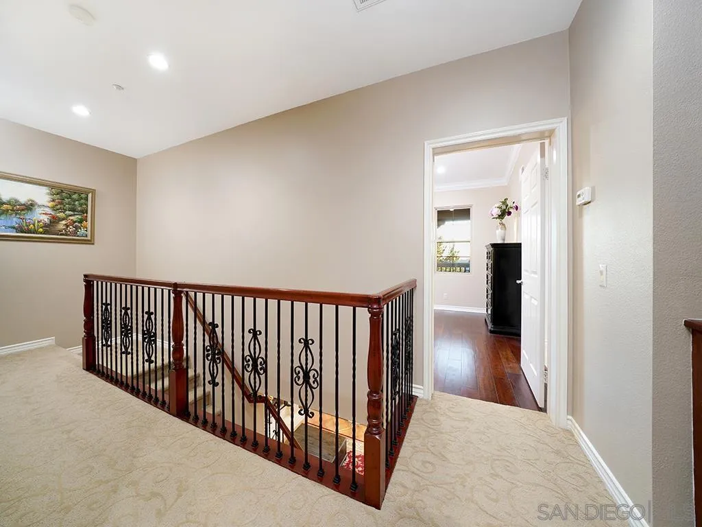 33 Tuscany Ladera Ranch, CA 92694 - Photo 40 of 50 a view of a hallway with wooden floor and a bathroom