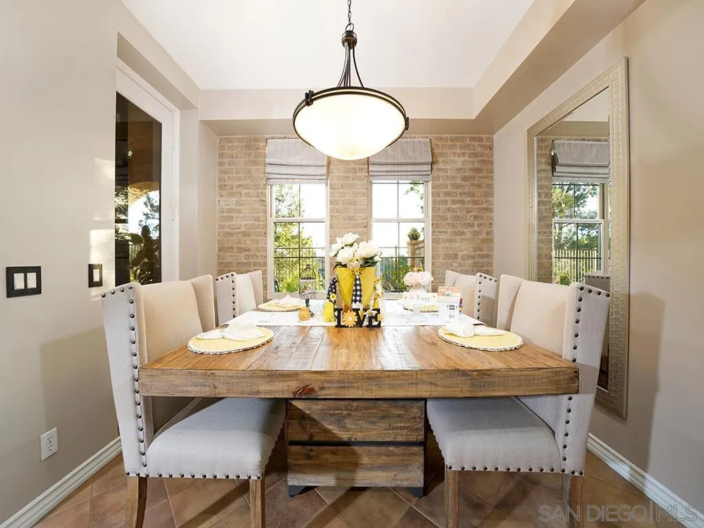 33 Tuscany Ladera Ranch, CA 92694 - Photo 10 of 50 a view of a dining room with furniture window and wooden floor