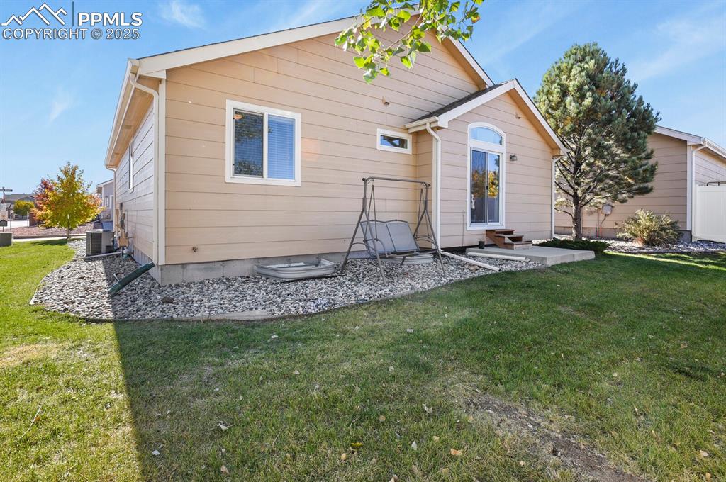 7394 Owings Point Peyton, CO 80831 - Photo 20 of 21 a front view of a house with garden