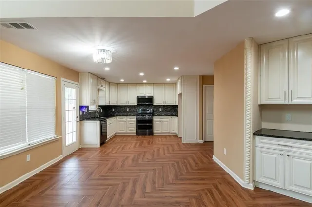 a view of kitchen with wooden floor