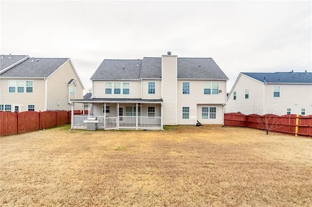an aerial view of a house with swimming pool and glass doors