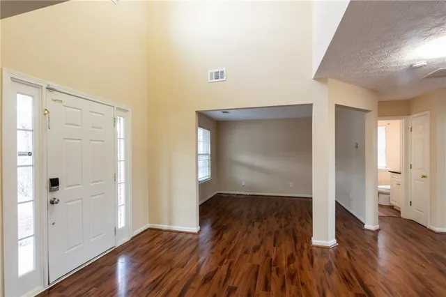 a view of hallway with wooden floor