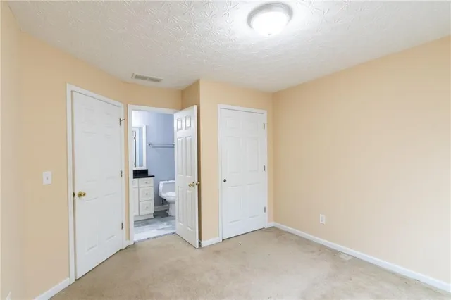 a view of room with windows and bathroom view