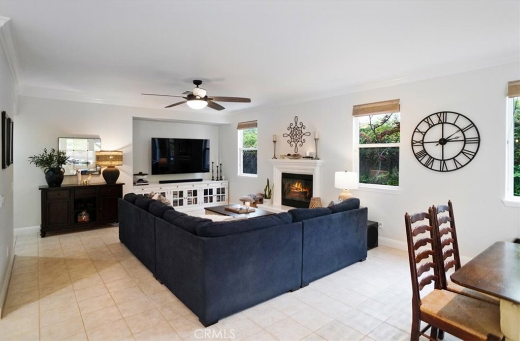 26511 Brooks Circle Stevenson Ranch, CA 91381 - Photo 17 of 55 a living room with furniture a fireplace and a flat screen tv