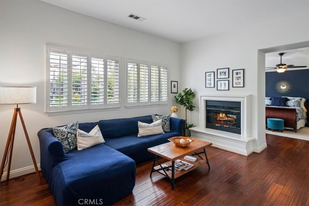 26511 Brooks Circle Stevenson Ranch, CA 91381 - Photo 32 of 55 a living room with furniture and a fireplace