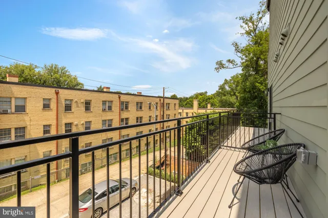 a view of balcony with furniture