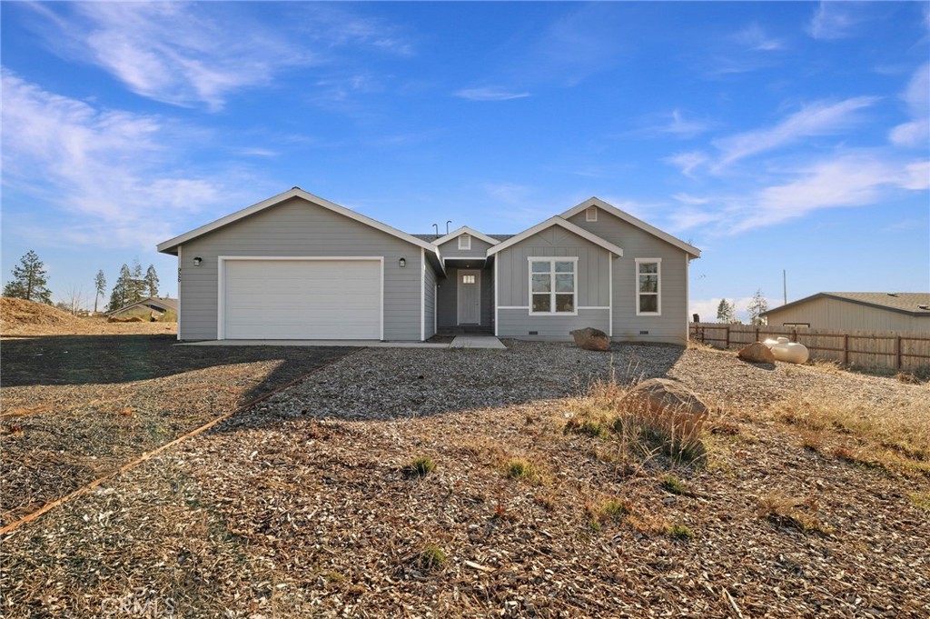 926 Bille Road Paradise, CA 95969 - Photo 1 of 28 a front view of a house with a yard