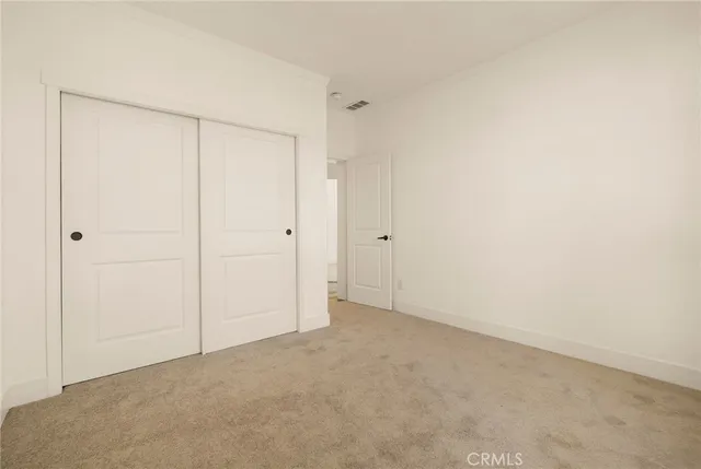 a bathroom with a double vanity sink a mirror and shower